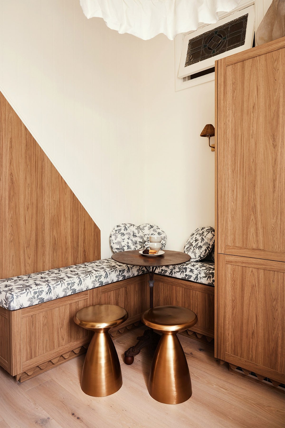 Under-stair kitchen nook with Boheme Paradise banquette and round cushions