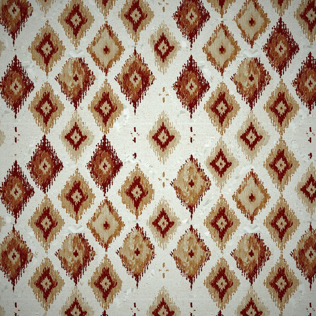Molonglo Lichen ikat swatch in Terracotta: rust, ochre and brick-red diamonds