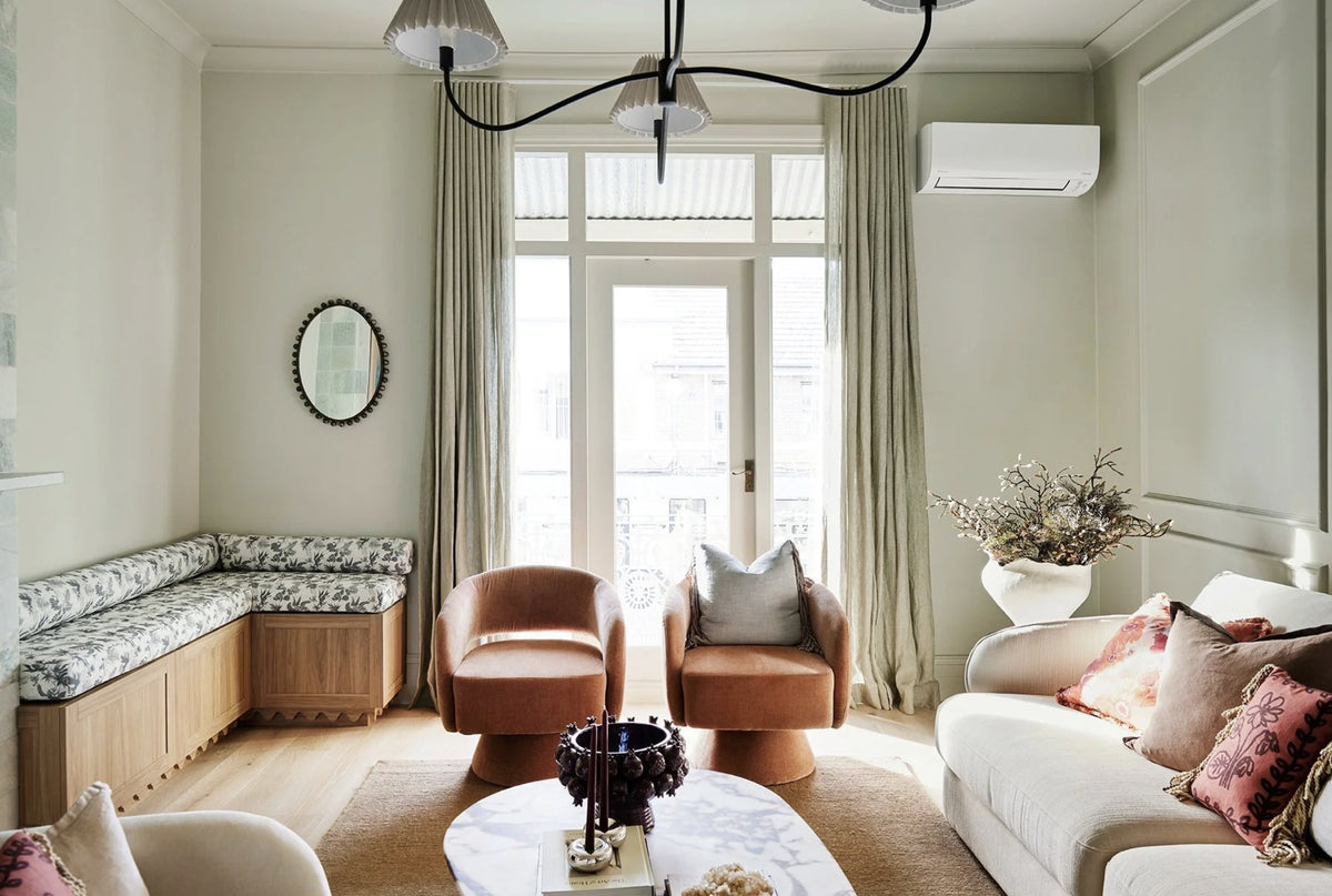Living room of Three Birds' The Petite Pad with a Boheme Paradise upholstered window seat